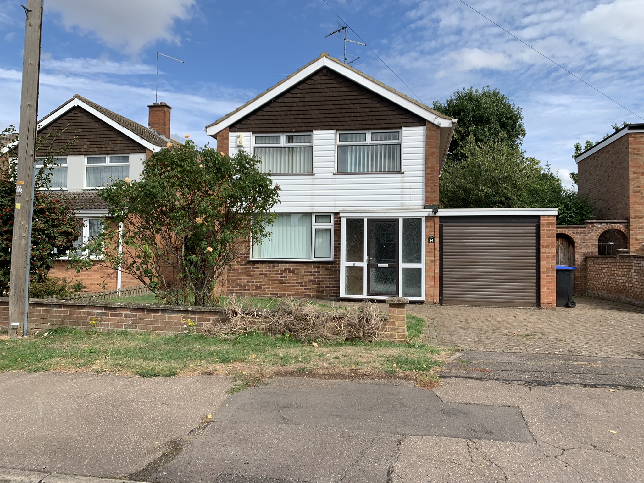 Front view of a house with a driveway and garage