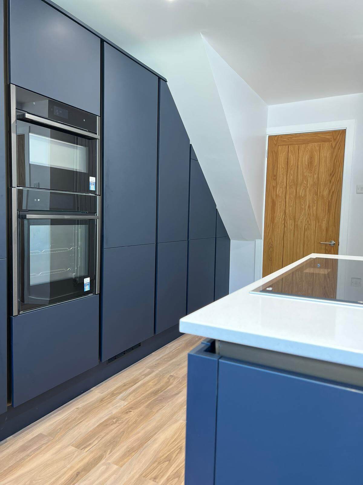 A view of the kitchen that includes the oven and a counter